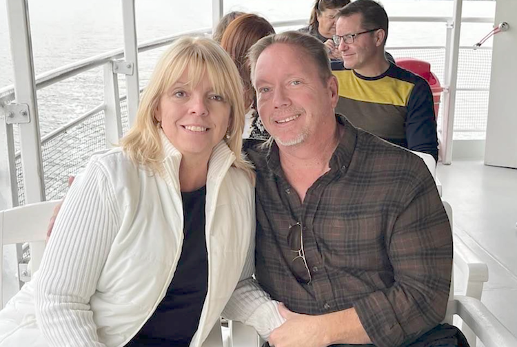 Man and woman smiling on ferry ride