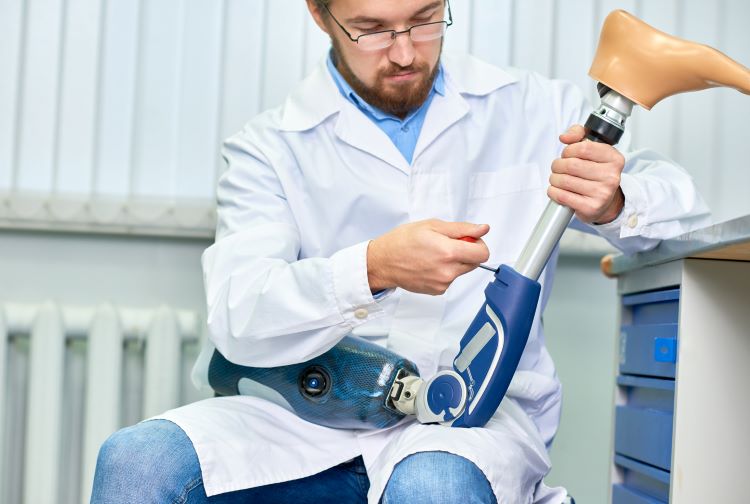Scientist holding artificial leg