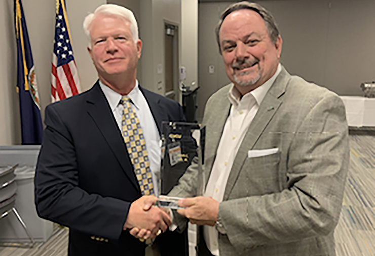 John Lee (right) is pictured here receiving a plaque from W. Scott Burnette, CEO, VCU Health Community Memorial Hospital, in appreciation for his nine years on the CMH Board of Directors.