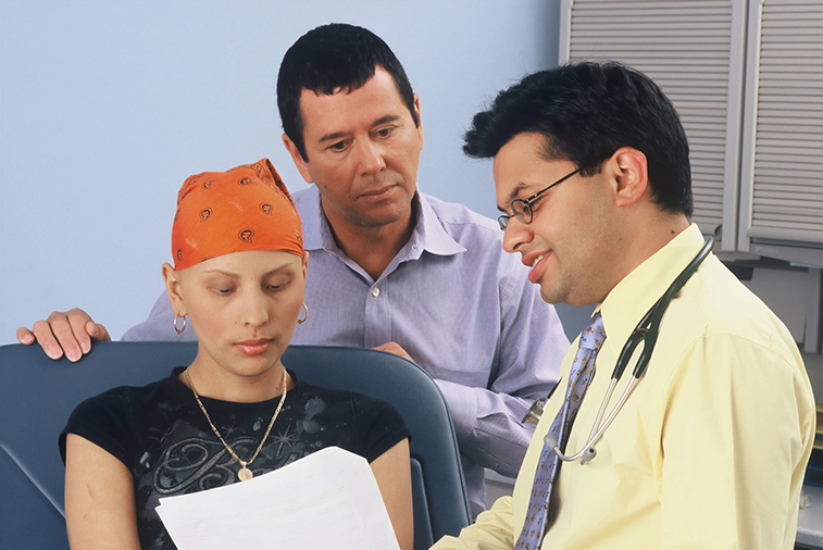 Patient looking at papers with a health provider