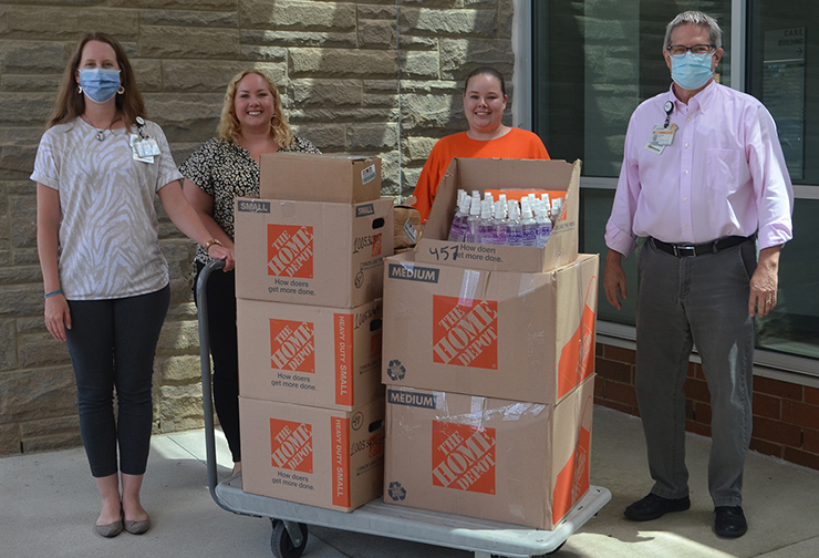The Home Depot in South Hill donated more than 800 wipes and hand sanitizer to VCU Health CMH. Pictured are Rebecca Sontag (VCU Health CMH), Sara Dean (Home Depot), Amanda Champion (Home Depot) and Ken Kurz (VCU Health CMH). 