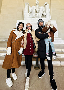 A family from the Philippines visits the Lincoln Memorial.