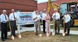 Hospital executives and donors hold shovels for a ground-breaking ceremony.