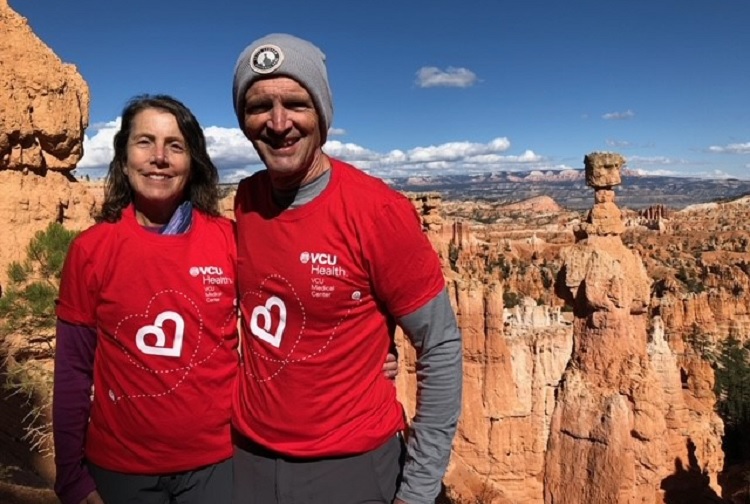 Man and wife hike Bryce Canyon, Utah 