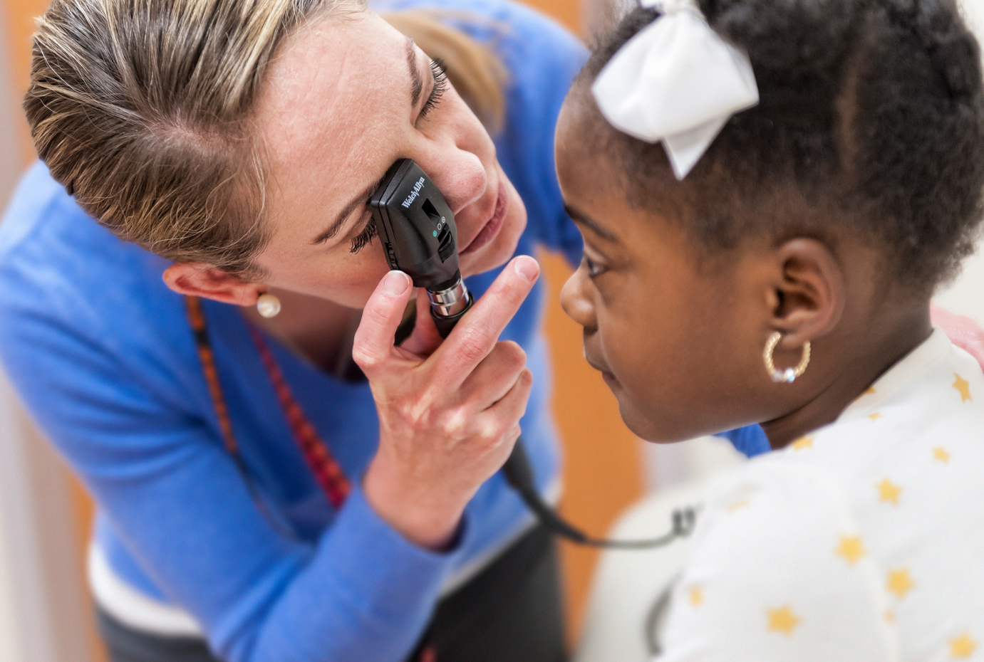 Provider examining childs eye