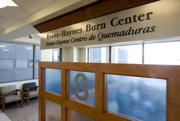 Hospital waiting room with sign that says Evan-Haynes Burn Center.