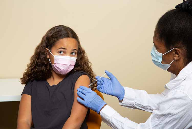 Girl getting vaccinated