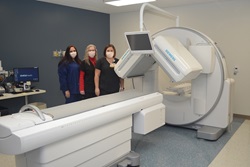 Tammy Richardson, Lisa Reese and Nikki Evans show off the nuclear medicine camera