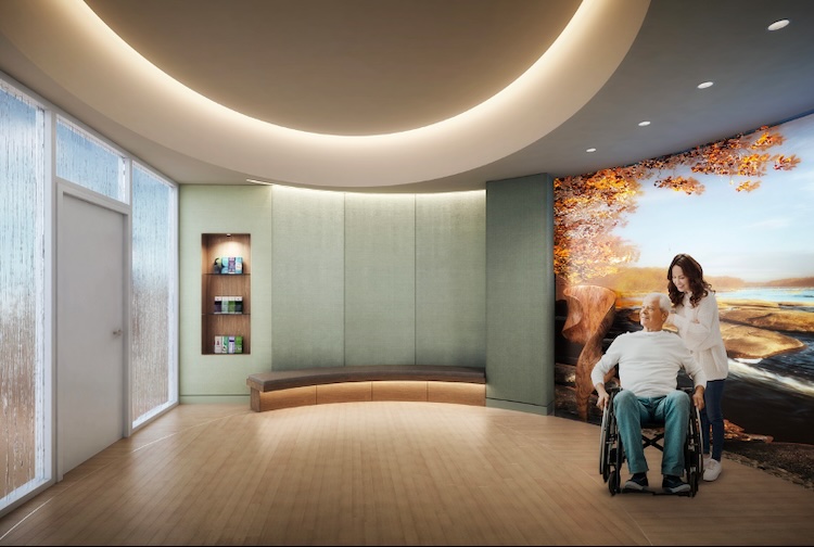 Rendering of a room that has a curved wall with a big screen on it is playing a nature video. Two people are in the room, one is a woman who is standing with a man who is in a wheelchair.