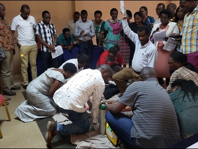 A group of people performing medicine in Rwanda