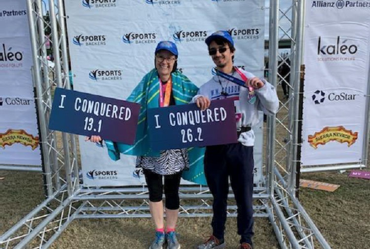Margaret McGugan celebrates making it to the finish line of the 2019 VCU Health Half Marathon with her son