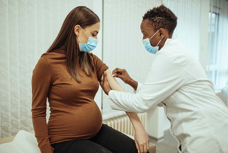 Pregnant woman getting COVID-19 vaccine