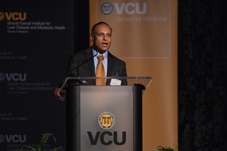 Devanand Sarkar, Ph.D., associate director for training and education at the VCU Massey Cancer Center, presents on his research