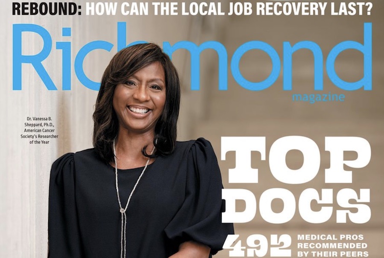 Cover of the Top Docs issue of Richmond Magazine, with a Dr. Vanessa Sheppard standing and smiling. She is wearing a black shirt and has a long necklace on.