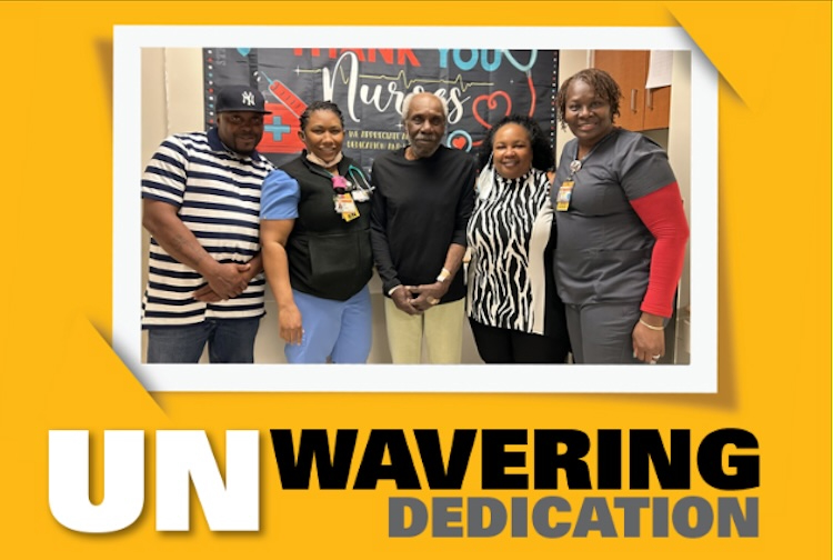 A family with two adult children and their father stand with two VCU Health team members who helped to reunite them. The five people are all smiling as they take a group picture.