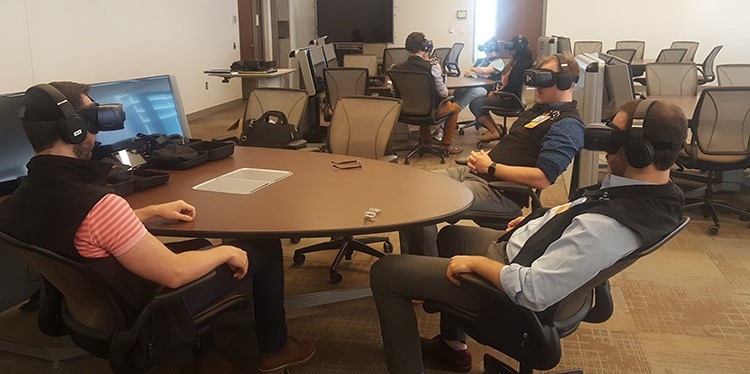 Medical students wearing virtual reality headsets.