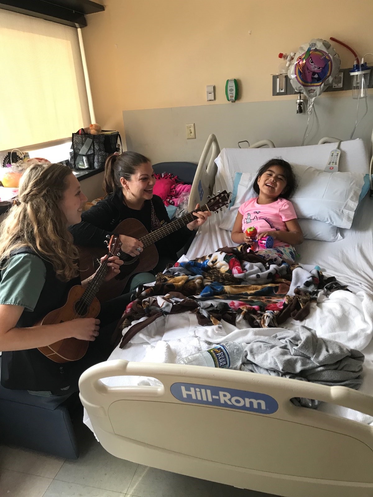 Two Music Therapists with a Pediatric Patient