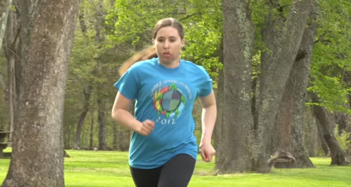 Trauma patient Malina Richardson running in a park.