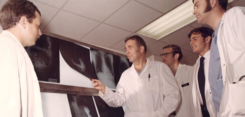 Photo of doctors examining X-rays for Virginia's first liver transplant