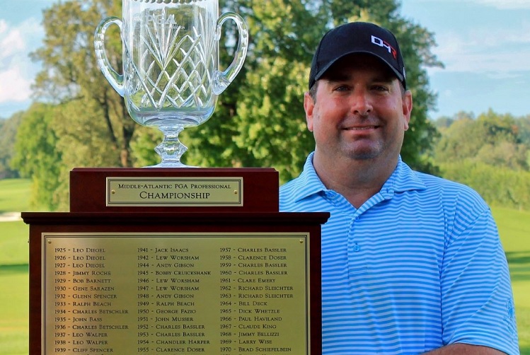 Sarcoidosis patient, Bryan Jackson, proudly holds the Middle-Atlantic PGA Professional Championship Trophy