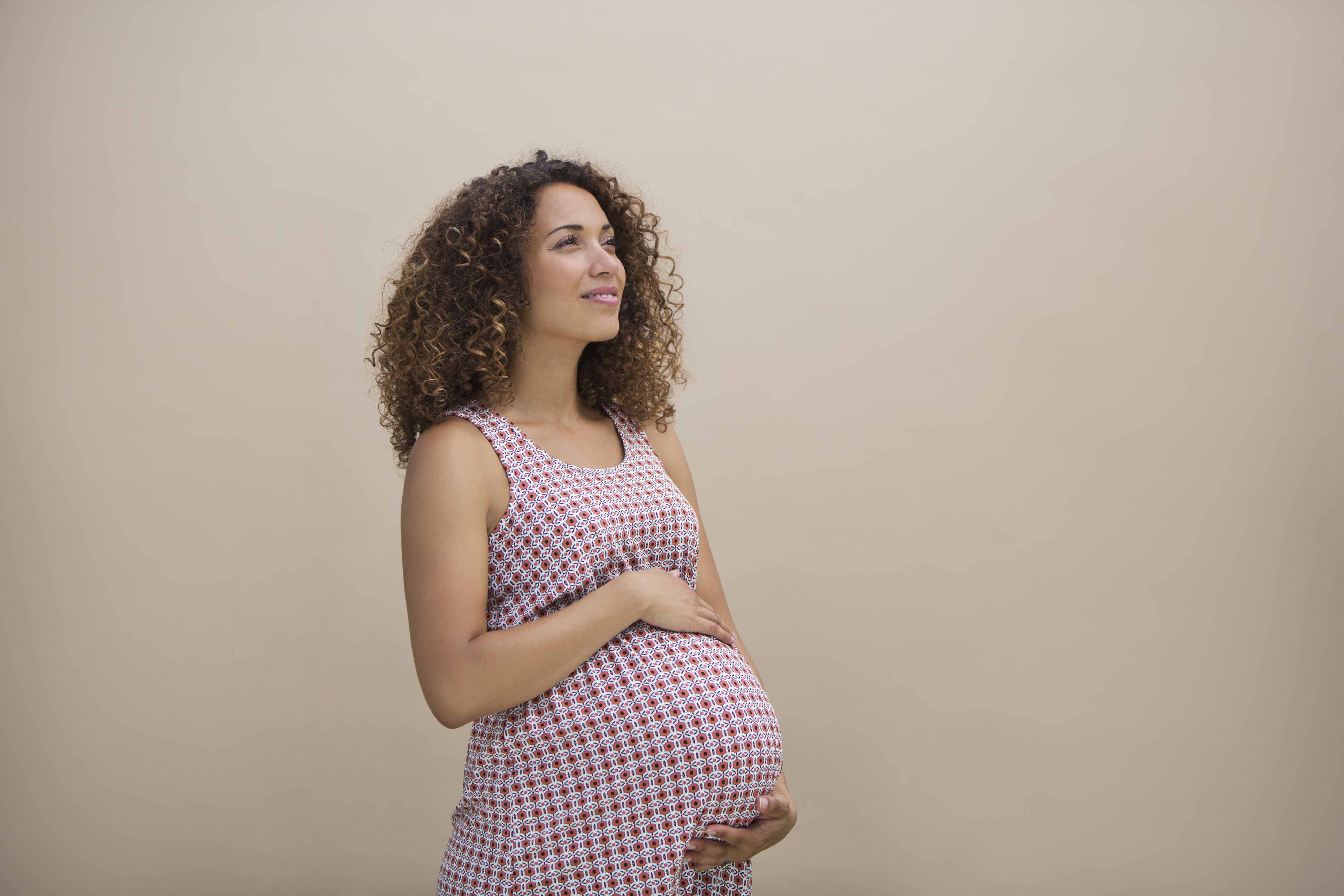Pregnant woman looking hopeful