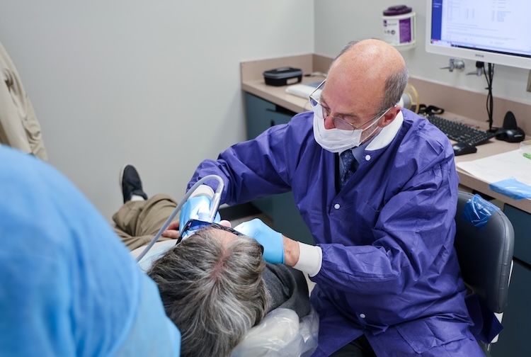 Dean Cooper examining a patient