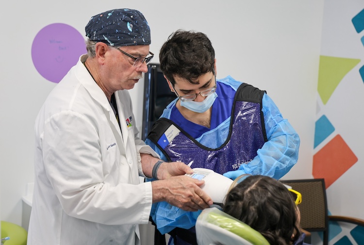 Doctor and Dental Student working together