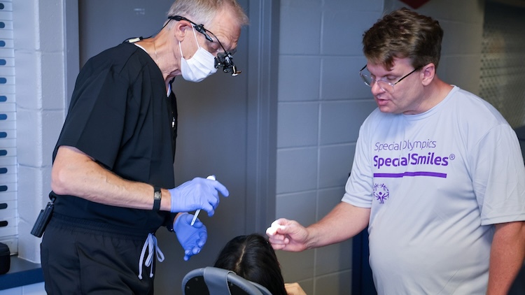 Dentist working with patient