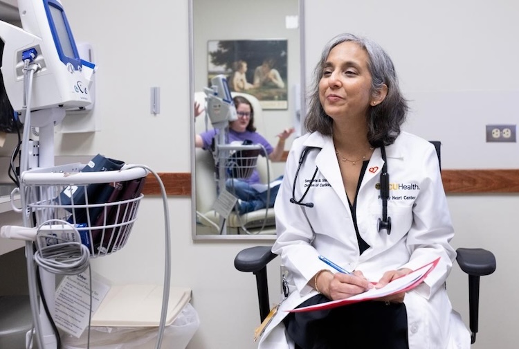 Doctor sits and listens to patient
