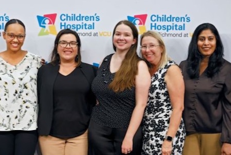 Several mothers stand together who donated breast milk during the inaugural milk drive held at Children’s Hospital of Richmond at VCU.