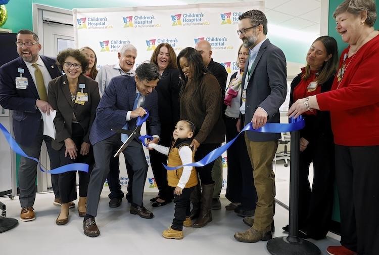 Leadership officials cutting the ribbon at the event