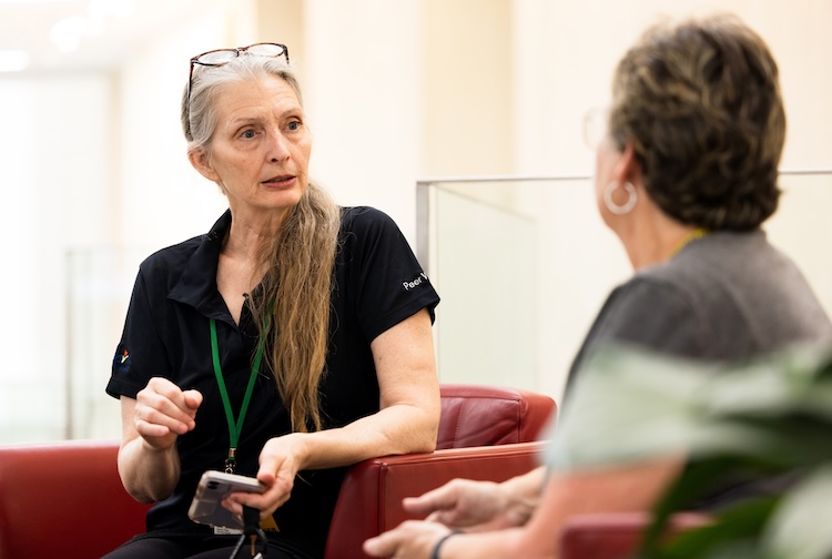 A trauma survivor provides support to another survivor