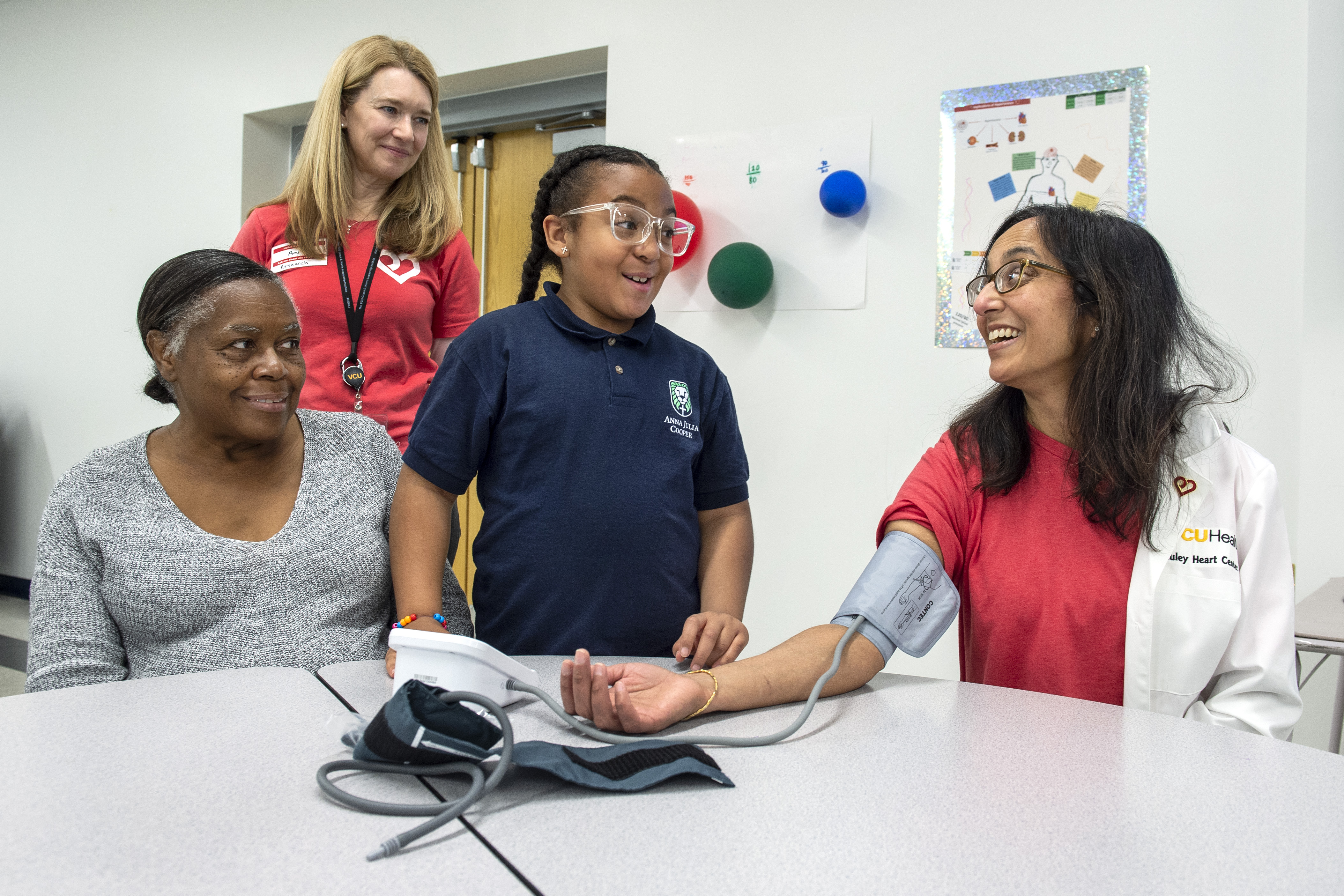 Child taking blood pressure of doctor