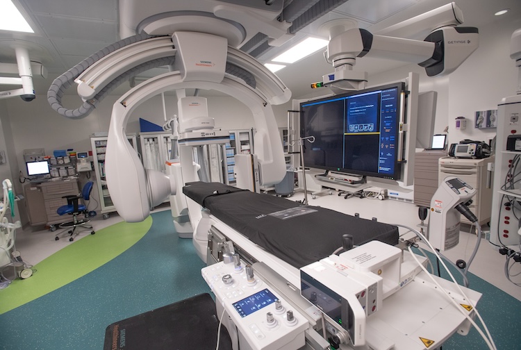 lab space with a bed for patients and high tech machines