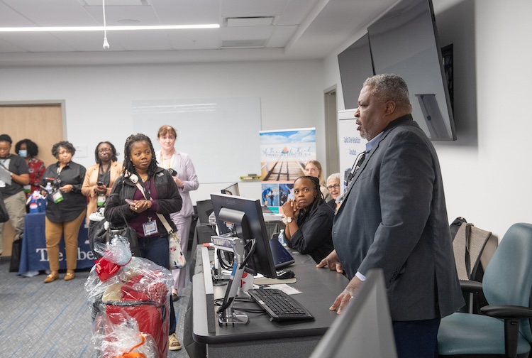Dr. Smith speaking to a room of people