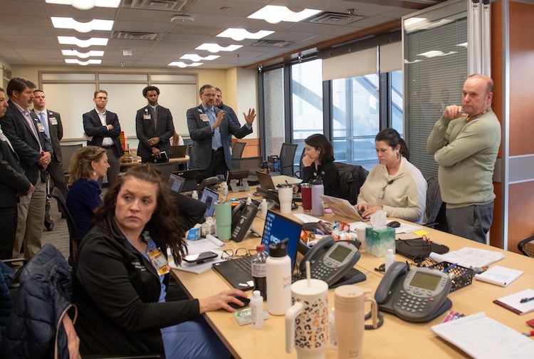 people sitting around a table working intently