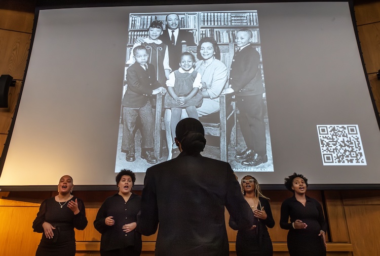Students singing on a stage