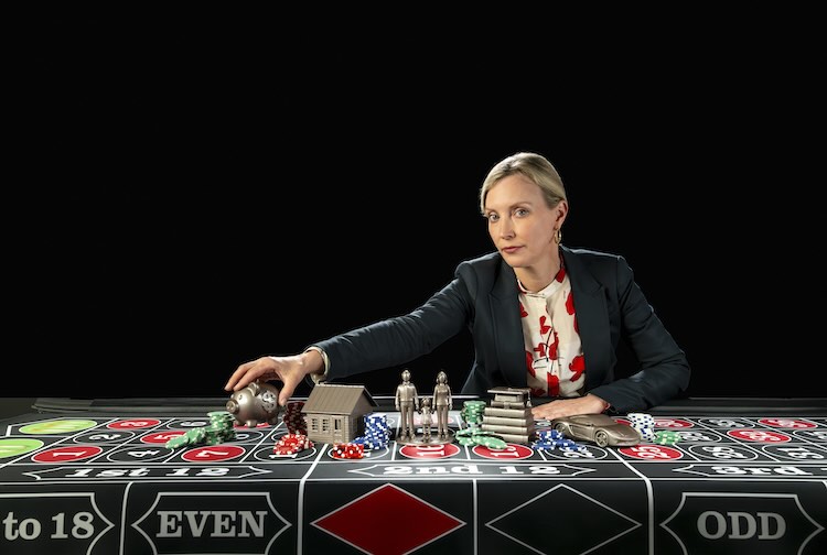 Hawley moving game pieces around on table