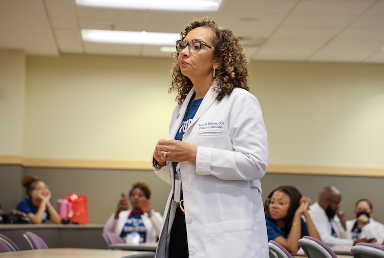 Dr. Laila Hishaw talking to a classroom full of students.
