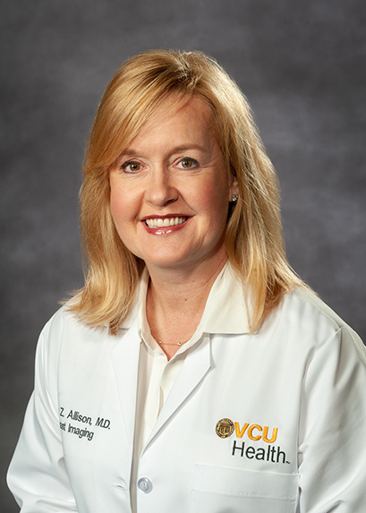 Dr. Kelley Z. Allison in a white medical coat