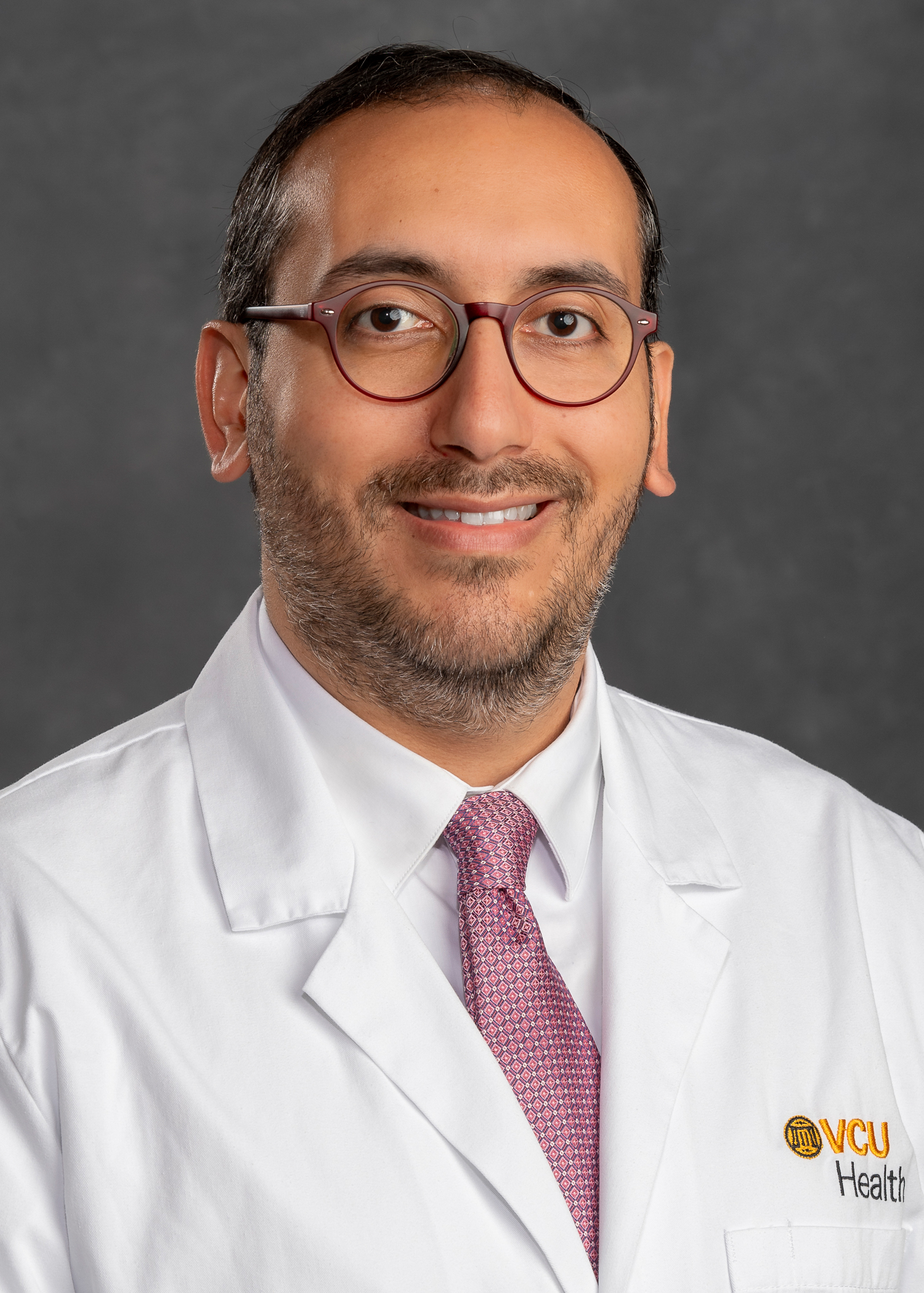 Pablo Arab, M.D., in a lab coat