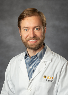 Dr. Matt Barrett in a white medical coat