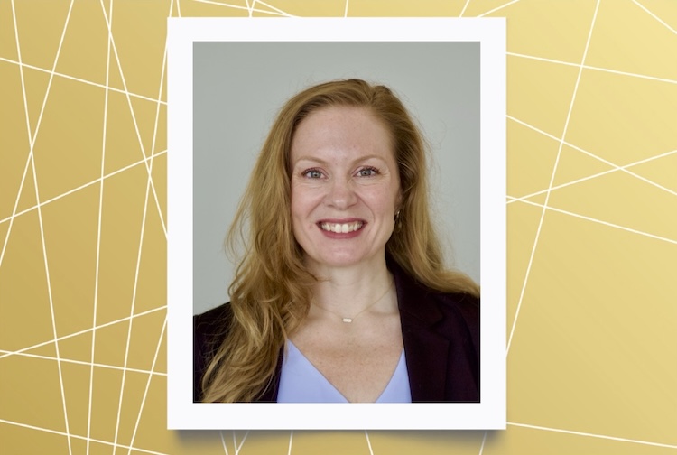 Brittany Poore is wearing a suit jacket and a blue shirt