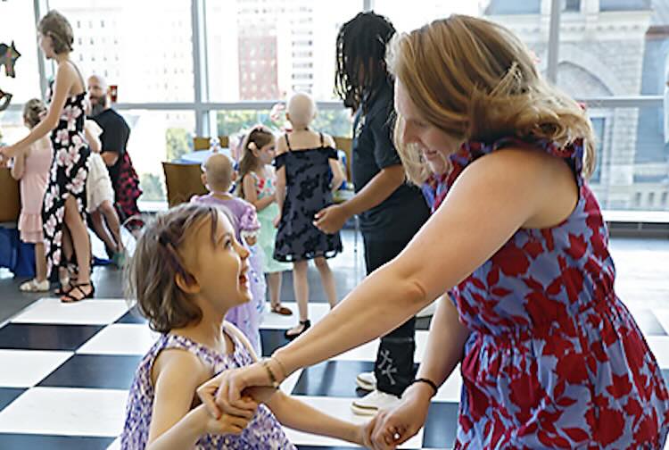 Mother and Daughter dancing in the hallway