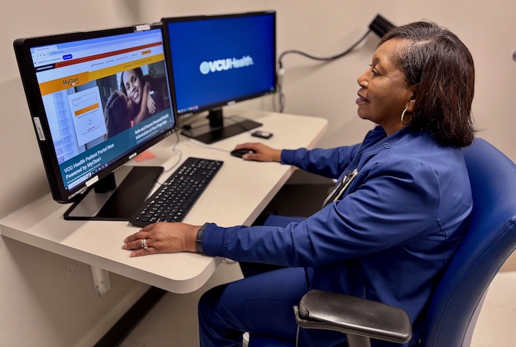 Woman on a computer about to set up a virtual clinic call