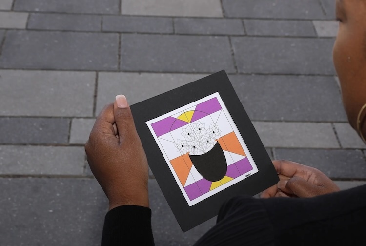 Lady holding photo within hands