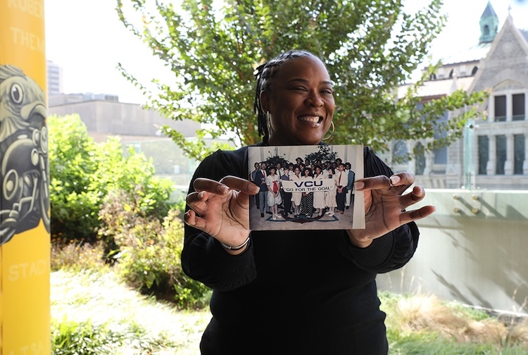 women holding photograph