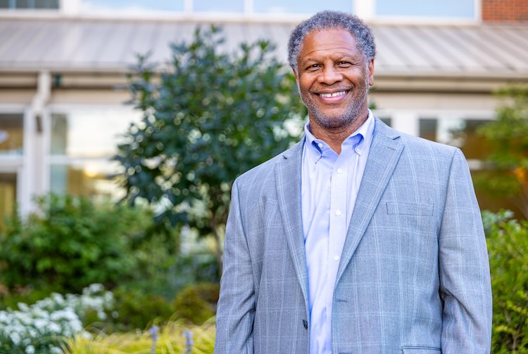 Dr. Winn wears a blue suit