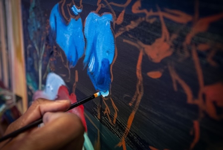 Close up of Chery’s brush painting on a canvas