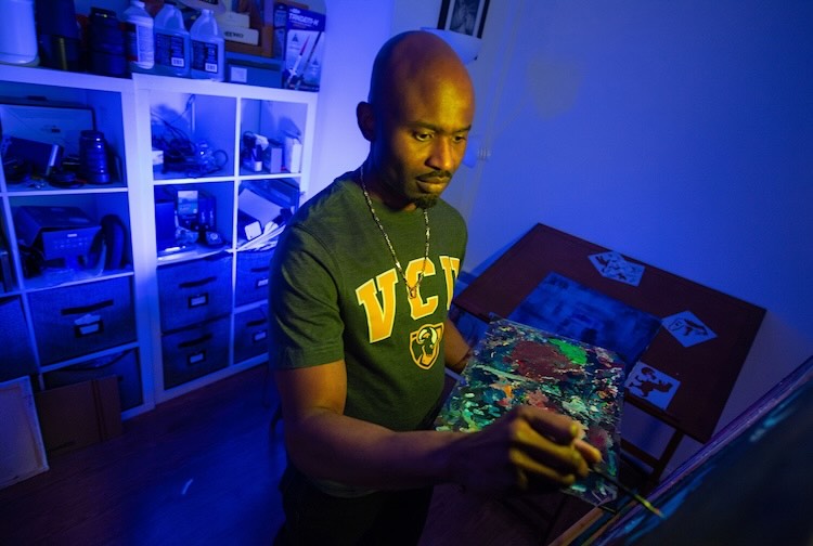 Dr. Chery paints at his home studio